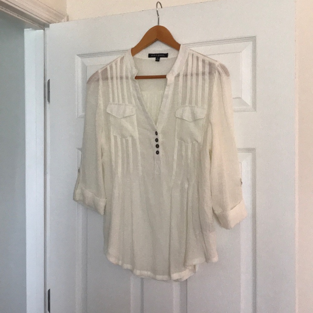 Sheer top with button sleeve